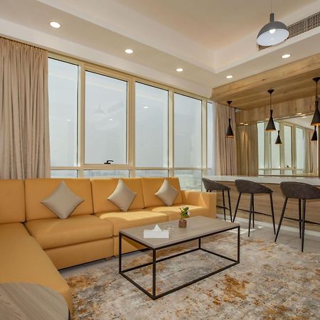 Platinum Coast Hotel Apartments Fujairah Room photo A living room in a suite at the hotel