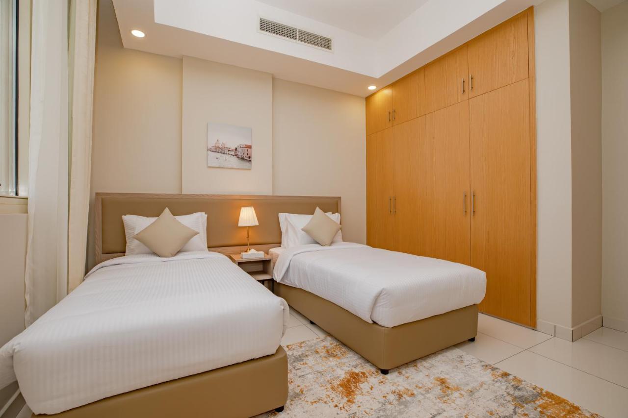 Platinum Coast Hotel Apartments Fujairah Exterior photo A bedroom with two single beds